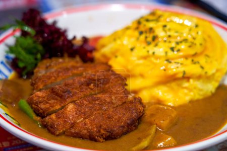 Crispy and delicious curry fried pork cutlet and omelette rice in Hong Kong style tea restaurant