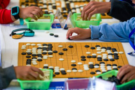 Two people are playing Go in a competition, Go match scene