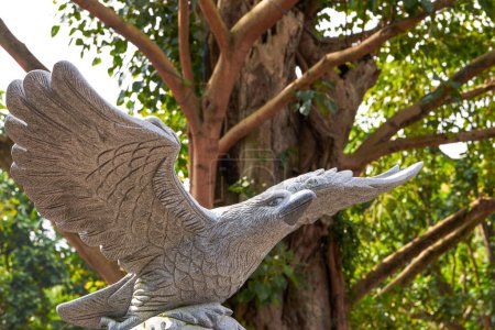 A lifelike sculpture of a soaring eagle with spread wings