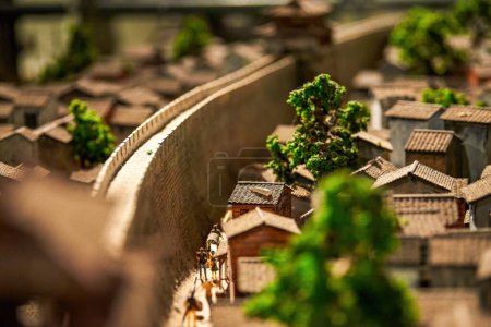 Un paisaje modelo de mesa de arena en miniatura de una antigua ciudad china