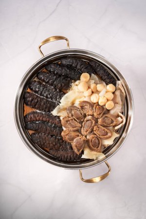 A pot of sumptuous and luxurious Chinese New Year Poon Choi, delicacies from both mountains and seas