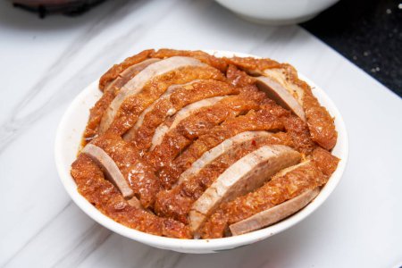 A bowl of fragrant and delicious traditional Chinese dishes, taro braised pork