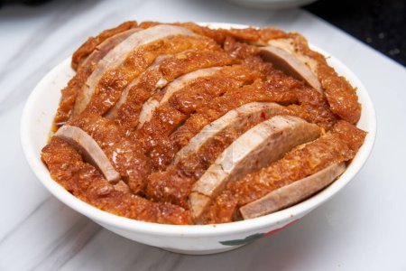 A bowl of fragrant and delicious traditional Chinese dishes, taro braised pork