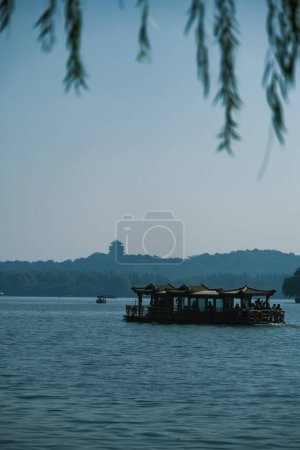 Beautiful scenery and pleasant people by the West Lake in Hangzhou, Zhejiang, China