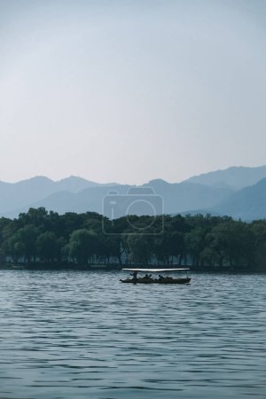 Beautiful scenery and pleasant people by the West Lake in Hangzhou, Zhejiang, China