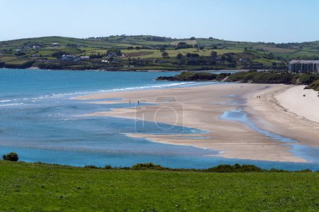 Photo for Inchydoney sandy beach at low tide on a sunny spring day. The famous Irish beach on the south coast of the country. Seaside landscape. - Royalty Free Image