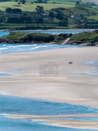Photo for Inchydoney beach at low tide, sunny day. The famous Irish beach on the south coast of the country. Seaside landscape. - Royalty Free Image