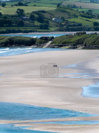 Photo for Inchydoney beach at low tide, day. The famous Irish beach on the south coast of the country. Seaside landscape. - Royalty Free Image