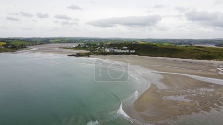 Photo for Inchydoney Beach in the south of Ireland on a cloudy summer day, top view. Seaside landscape. The famous Irish sandy beach. The coastline of the Atlantic Ocean. - Royalty Free Image