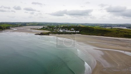 Photo for Inchydoney Beach in the Ireland on a cloudy summer day, top view. Seaside landscape. The famous Irish sandy beach. The coastline of the Atlantic Ocean. - Royalty Free Image