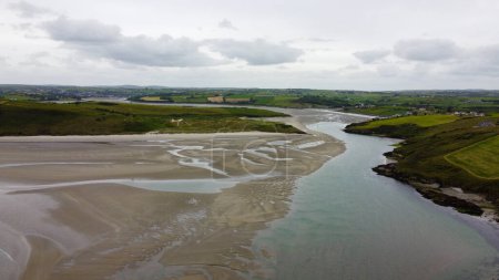 Photo for Inchydoney Beach on a cloudy summer day, top view. Seaside landscape. The famous Irish sandy beach. The coastline of the Atlantic Ocean. - Royalty Free Image