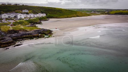 Photo for Inchydoney Beach on a cloudy day, top view. Seaside landscape. The famous Irish sandy beach. The coastline of the Atlantic Ocean. - Royalty Free Image