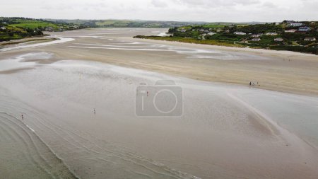 Photo for Inchydoney Beach on a day. Seaside landscape. The famous Irish sandy beach. The coastline of the Atlantic Ocean. - Royalty Free Image
