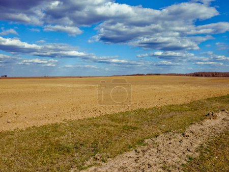 Photo for Open landscape, clear skies, and a barren field. - Royalty Free Image