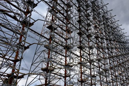 A series of metallic constructs, heavily wired, showing signs of rust. Duga is a Soviet over-the-horizon radar station for an early detection system for ICBM launches.