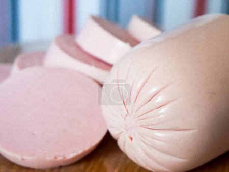 Prepped Sausage Slices. Pink sausage slices on wood, great for recipe sites.