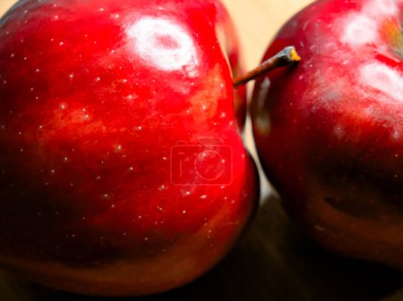 Shiny Apples Close-Up. Close-up of two red apples, highlighting natural beauty.
