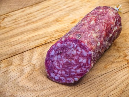 The salamis rich color and visible fat content indicate a high-quality product