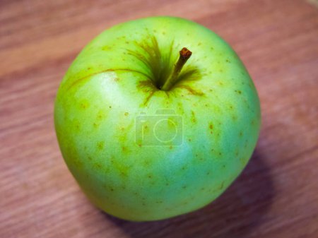 Bright image of a single apple, suggesting simplicity and focus on healthy eating.