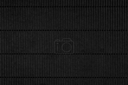 Foto de Black corrugated paper background with a striped pattern in rows. Cardboard grunge lines. Abstract blank for dark design - Imagen libre de derechos