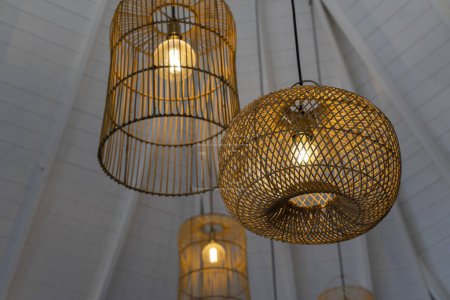 Photo for Some hanging wicker lamps. different designs - Royalty Free Image