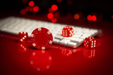 Poker chips lie on the keyboard. Poker online. Online gambling. Online casino. Internet.