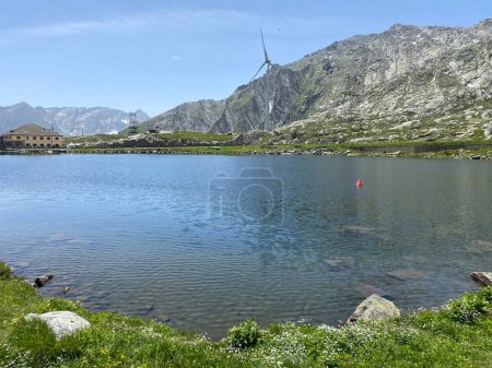 Photo for Summer atmosphere on the Lago della Piazza lake (Lake of the Piazza) in the Swiss alpine area of the mountain St. Gotthard Pass (Gotthardpass), Airolo - Canton of Ticino (Tessin), Switzerland (Schweiz) - Royalty Free Image