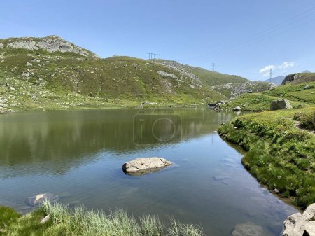 Photo for Summer atmosphere on the Lago dei Morti or Lake of the Dead (Totensee) in the Swiss alpine area of mountain St. Gotthard Pass (Gotthardpass), Airolo - Canton of Ticino (Tessin), Switzerland (Schweiz) - Royalty Free Image