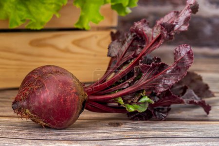 Photo for Red beets on wooden table - Royalty Free Image
