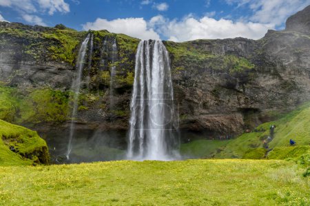 The magnificent Seljalandsfoss waterfall in Iceland. Location: Seljalandsfoss waterfall, part of the Seljalandsa river, Iceland, Europe