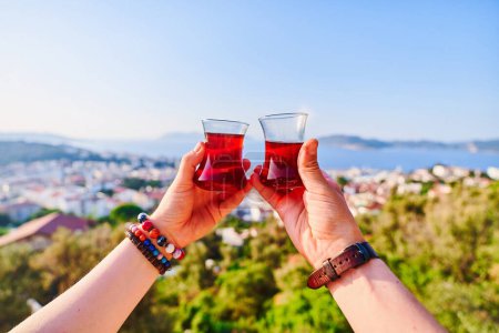 Photo for Drinking traditional Turkish tea with a beautiful view at sunny day during vacation holidays - Royalty Free Image