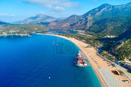 Photo for Aerial view of mediterranean sea bay with mountain, sandy beach and boats at sunny day in summer. Drone photo of Blue lagoon in Oludeniz, Turkey - Royalty Free Image
