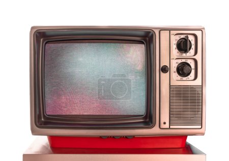 Photo for Plastic made grandma's vintage cathode ray analog television monitor used for TV broadcasts, films, and video games with random pixel pattern on the screen called electronic noise on a white backdrop - Royalty Free Image