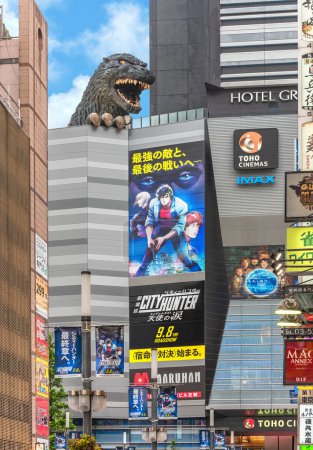 Photo for Tokyo, japan - sep 08 2023: The Godzilla statue of Kabukicho Central Road during the roadshow of the Japanese manga and anime movie City Hunter aka Nicky Larson in the red-light district of Shinjuku. - Royalty Free Image