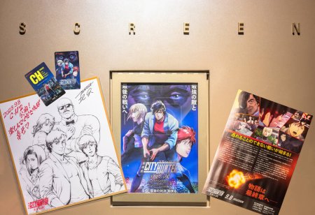 Photo for Tokyo, japan - sep 08 2023: Poster of the Japanese anime Angel Dust adapted from the manga City Hunter known also as  Nicky Larson on a cinema wall with two movie tickets and an illustration offered. - Royalty Free Image