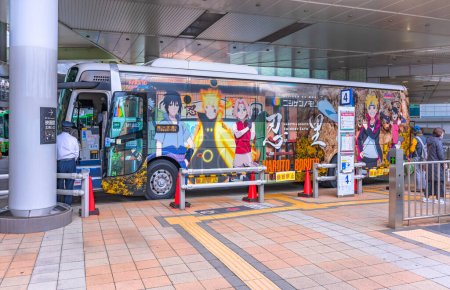 Photo for Osaka, japan - dec 04 2022: Tourist bus leaving for Awaji island wrapped in an advertising sticker of characters from Japanese manga and anime Naruto in collaboration with nijigen no mori theme park. - Royalty Free Image