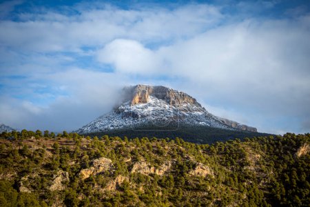Top of a snowy mountain illuminated by the morning sun in the Regional Park of Sierra Espuna, in the Region of Murcia, Spain