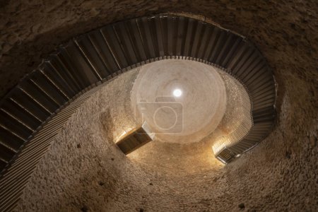 Photo for Interior of a Snow Well in Sierra Espuna, Region of Murcia, Spain. View of the medieval brick dome and the access staircase to the interior - Royalty Free Image