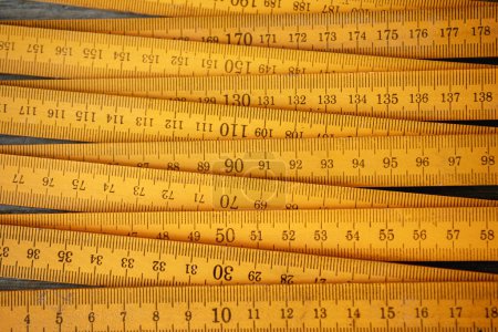 Photo for Traditional yellow wooden folding rule with decimal metric system - Royalty Free Image