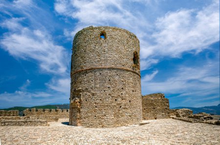 Photo for Cylindrical tower of the castle of Jimena de la Frontera, Cadiz from the 8th century with blue sky and midday light - Royalty Free Image