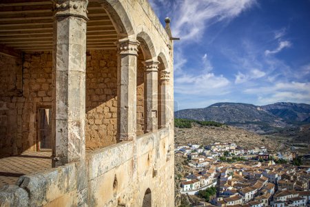 Photo for Renaissance balconies of the Vlez-Blanco castle, Almera, Andalusia, Spain, with pleasant natural light and the town and mountains in the background - Royalty Free Image