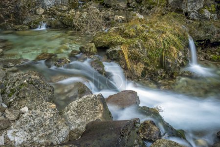 Detail of small waterfalls at the source of the Mundo River in Riopar, Albacete, Castilla la Mancha, Spain with soft light