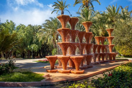 Famous Glorieta fountain in the palmeral municipal park in Elche, Alicante, Valencian Community, Spain