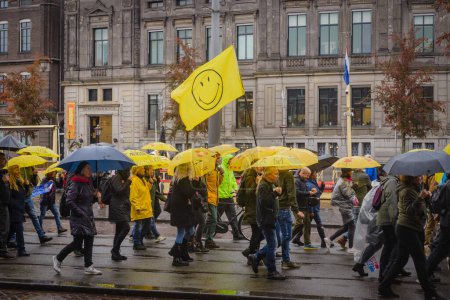Photo for 06 November 2022, Amsterdam, Netherlands, despite official cancellation protestors gathered on the Dam Square. Conspiracy theorists David Icke was denied entry to the Netherlads as well as Schengen area for two years - Royalty Free Image