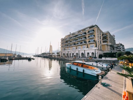 Small yachts are moored near the pier of the Regent Hotel in Porto. Montenegro. High quality photo