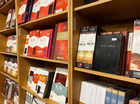 Photo for Bibles and religious books stand on the shelves. High quality photo - Royalty Free Image