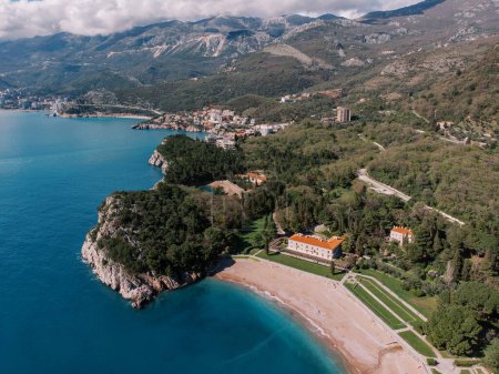 Villa Milocer in a green garden near the royal beach. Montenegro. Drone. High quality photo