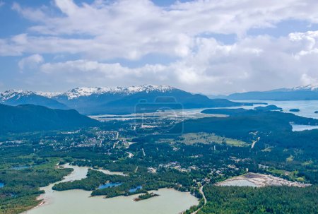 Aerial view of Juneau, Alaska, landscape of mountains and bodies of water.
