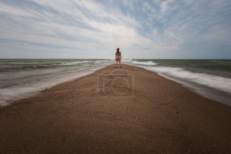 Photo for Point Pelee National Park is southernmost point of mainland Canada.  This is my wife looking south towards the United States. - Royalty Free Image
