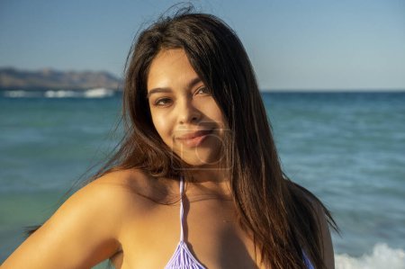 Photo for Beautiful black hair girl mexican latina portrait on the beach in baja california sur - Royalty Free Image